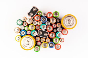 Composition with alkaline batteries on white background. Chemical waste. Top view.
