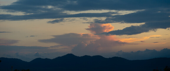 Fototapeta na wymiar Sunset, clouds, beautiful color changing over the mountains, beautiful colors, panorama shot.