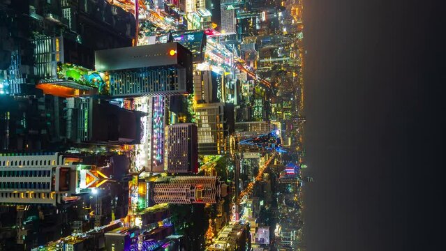 vertical time lapse of Bangkok city downtown and road traffic at night in Thailand , Cityscape