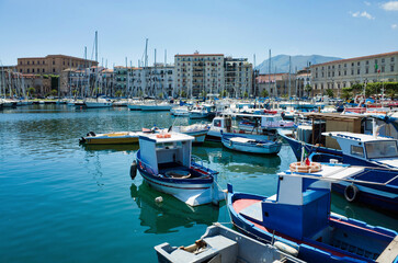 Palermo, Sicily - July 29, 2016: Small port with fishing boats in the center of Mondello