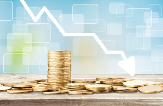 Stack of coins bar chart and graph trending downwards. Economy recession crisis, inflation, stagflation, business and financial loss concept.