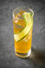 bright colored alcoholic cocktail on a black stone background