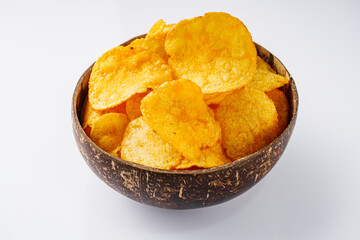 golden crispy potato chips on a white background