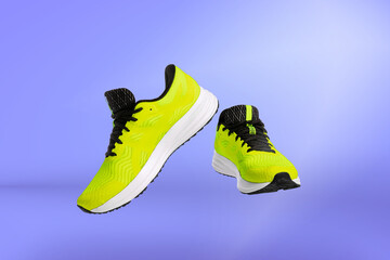 Modern unisex footwear, sneakers isolated on purple background. Fashionable stylish sports casual shoes. Creative minimalistic layout with footwear.