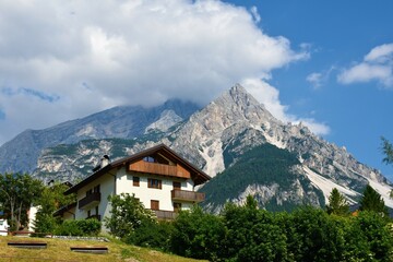 House in San Vito di Cadore village bellow mountain Monte Antelao in the Dolomite Mountains in...