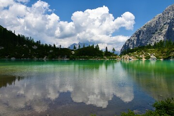 Scenic view of lake Sorapis in Dolomite mountains near Cortina d ampezzo in Veneto region and Belluno province in Italy with a reflection of the clouds in the water