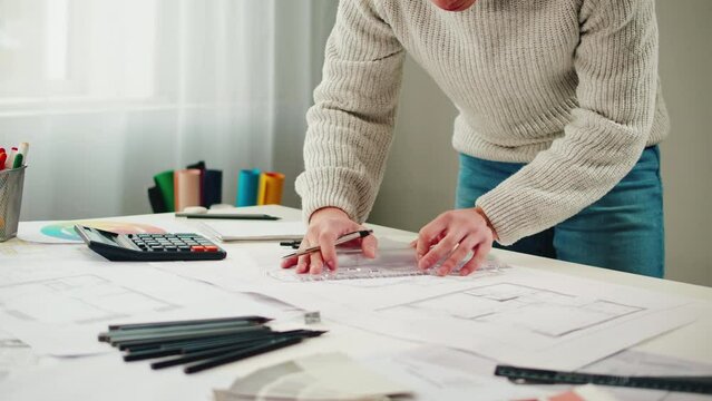 Architect designer workplace close-up. Professional engineer working with drawings, interior creator working with house project, blueprint plan, drafting building.