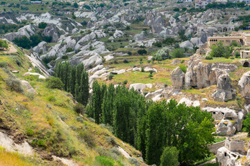 Fototapeta na wymiar Cave settlements of Cappadocia. Ancient buildings underground city. Dwellings in the rock Turkey.