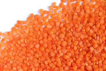 Red lentils isolated on white background. Top view. Copy space.