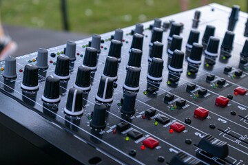Closeup of a Professional Audio Mixing Console