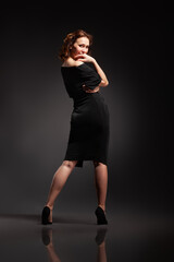 Fototapeta na wymiar High fashion portrait of elegant woman in long black dress.
