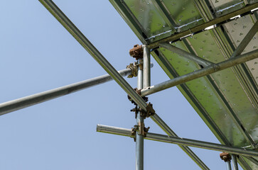 Scaffolding construction: detail with load-bearing structure in galvanized steel and transverse and...