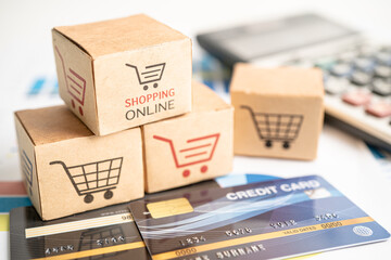 Shopping online box with credit card and calculator on graph. Finance commerce import export...