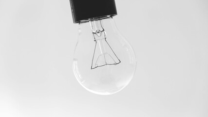 Transparent light bulb on a white background