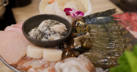 Bowl of seafood for hotpot in restaurant