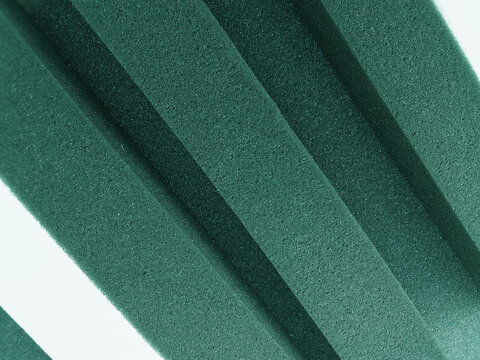 diagonal styled turquoise green sponge foam texture isolated on white background © aulia sailan ilma