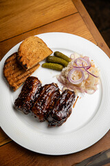 Food. Grilled Meat And Vegetables With Sauce Closeup. Grilles Pork Ribs In Restaurant.