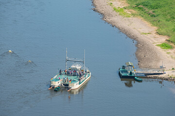 Ferry service with modern catamaran at Bastei sandstone pillars near Kurort Rathen village in the...