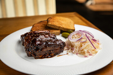 Food. Grilled Meat And Vegetables With Sauce Closeup. Grilles Pork Ribs In Restaurant.