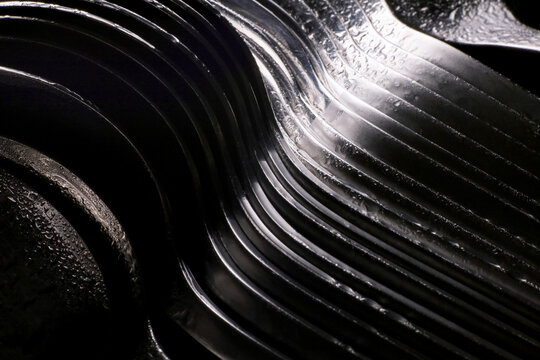 Close-up Detail Of Stacked Metal Spoons And Forks  Background
