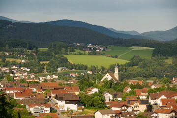 Fototapeta na wymiar Scenic view over the town Viechtach in Lower Bavaria, Germany on a bright sunny summer day with Bavarian Forest in background