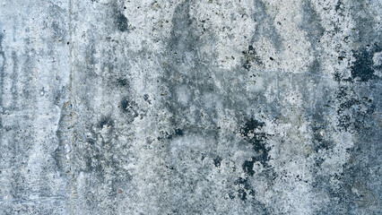Old cement wall texture background with black and white stains