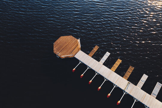 Boat pier on lake with sunset light in Estonia 