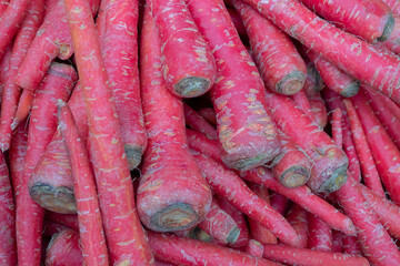 Carrot, Daucus carota , is a root vegetable, usually orange in colour, a domesticated form of the wild carrot. Vegetables for sale in a market in Territy Bazar, Kolkata, West Bengal, India.