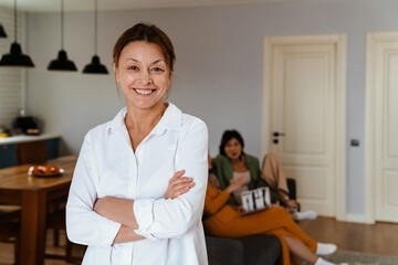 Fototapeta premium Mature woman smiling while spending time with her friends