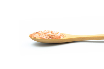 Close-up Wooden spoon have salt hima layan pink color isolated on the white background.