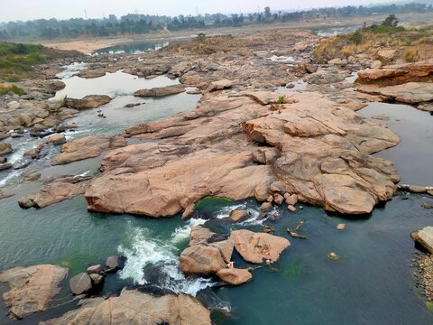 A beautiful Damodar river with some big rocks in it in India