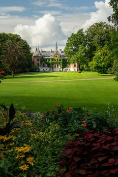 Vertical shot of a Sofiero Palace with a beautiful garden, Sweden