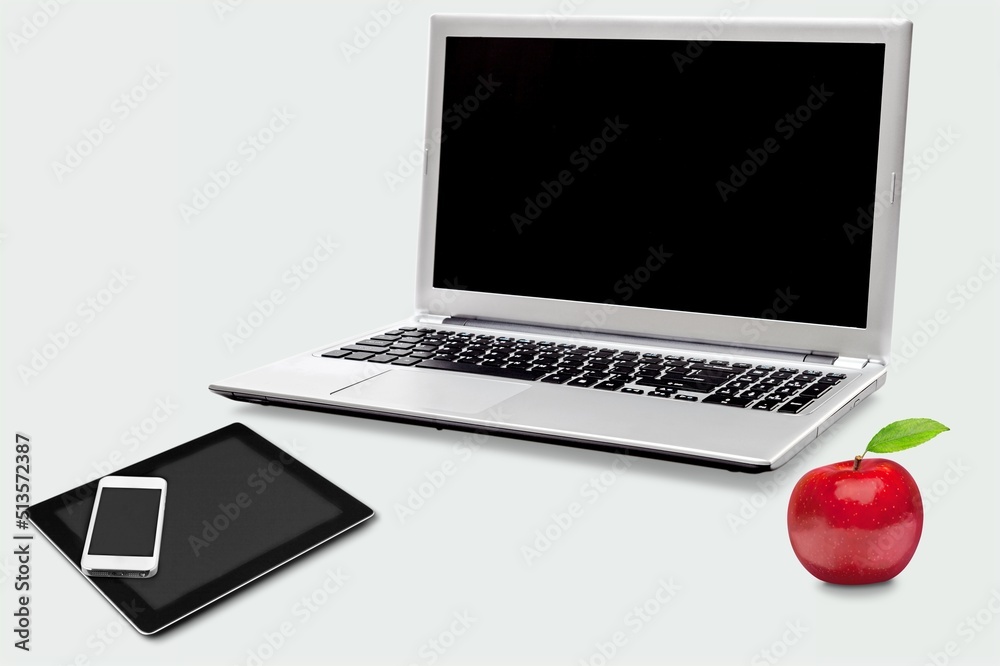 Canvas Prints laptop mockup with a blank screen on the desk and apple