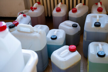 Toxic waste in jerry cans in the chemistry laboratory. - obrazy, fototapety, plakaty