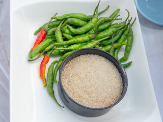 green chili pepper  and  sugar bowl