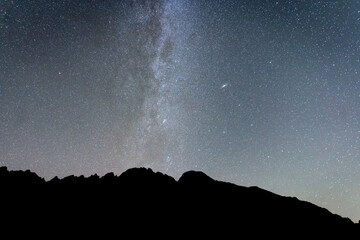 Milky way a and sky full of stars above mountains silhouette , Slovakia, Europe