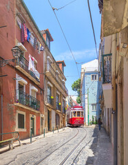 The tram runs along Calcada de Sao Vicente street in Alfama. Lisbon, Portugal