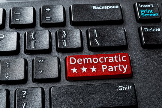Democratic Party red key on a decktop computer keyboard. Concept of voting online for Democratic party, politics, United States elections. Laptop enter key with Democratic Party word message.