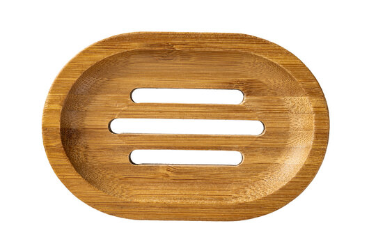 Bamboo soap dish cutout. Empty wooden soap holder isolated on a white background. Plastic free bathroom accessories. Eco-friendly lifestyle. Living green concept.