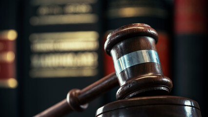 Gavel of justice on books background	
