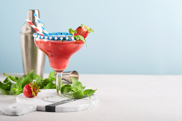 Patriotic Cocktail 4th july. Glass margarita cocktail with strawberry, mint and iced. Drinks for...