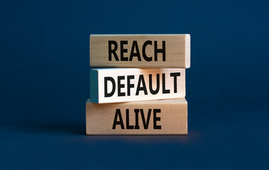Reach default alive symbol. Concept words Reach default alive on wooden blocks on a beautiful grey table grey background. Business, finacial and reach default alive concept. Copy space.