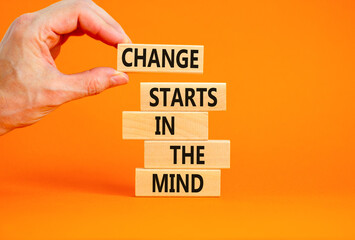 Change starts in the mind symbol. Concept words Change starts in the mind on wooden blocks on a beautiful orange table orange background. Business motivational and change starts in the mind concept.