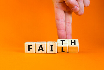 Faith instead fail symbol. Businessman turns wooden cubes and changes the concept word Fail to Faith. Beautiful orange table orange background. Business and faith instead fail concept. Copy space.