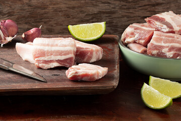 Traditional pancetta, sliced bacon made with pork belly. 
