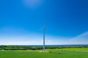 Panoramic shot from a bird's eye view of wind turbines in the middle of fields. Wind turbine...