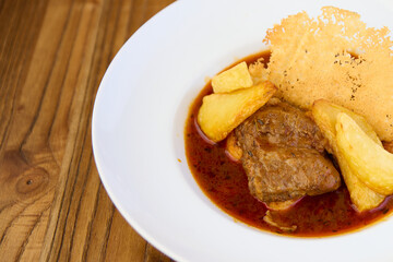 beef stew with potatoes and Parmesan cheese