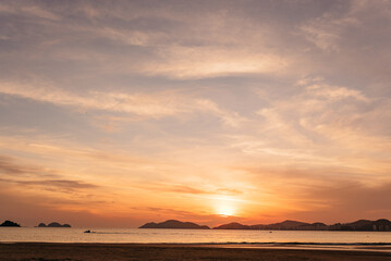 Fototapeta na wymiar Landscape - Sunset with birds on guaruja beach