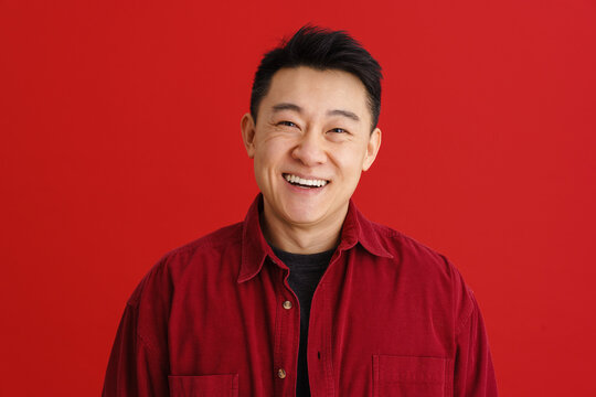 Brunette Adult Asian Man Wearing Shirt Smiling At Camera