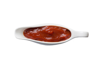 Creamy ketchup sauce in the white sauceboat. ketchup sauce isolated on white background. top view